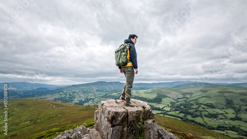 backpack hiker on the Sugar Loaf, mountain peak, Abergavenny, Monmouthshire Wales, United Kingdom
