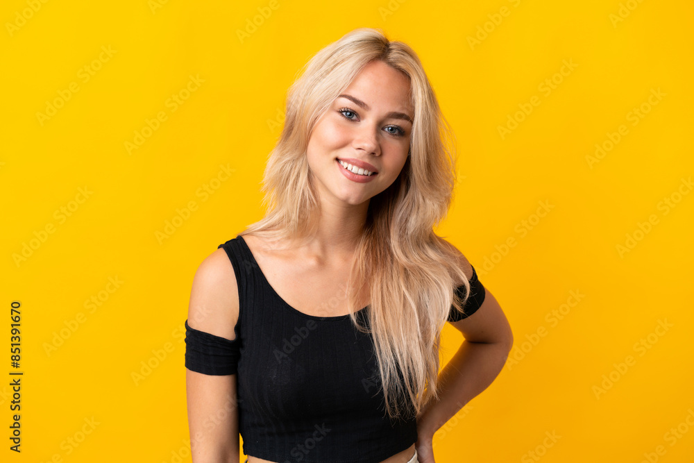 Young Russian woman isolated on yellow background laughing Young Russian woman isolated on yellow background laughing