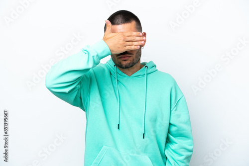 Young caucasian man isolated on white background covering eyes by hands. Do not want to see something