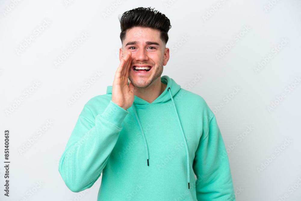 Young caucasian man isolated on white background shouting with mouth wide open Young caucasian man isolated on white background shouting with mouth wide open