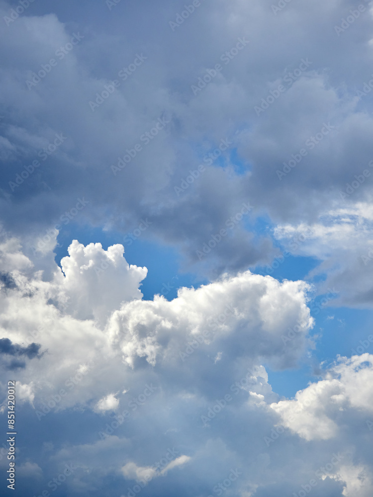 Cumulus clouds. White clouds on the blue sky close-up. Cumulus clouds. White clouds on the blue sky close-up.
