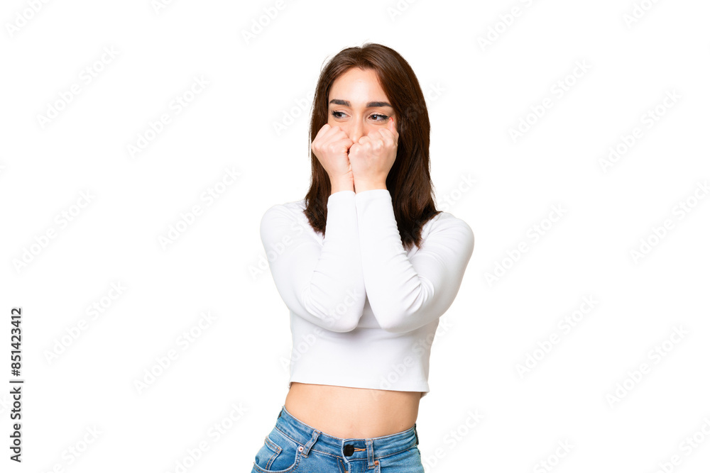 Young caucasian woman over isolated chroma key background nervous and scared putting hands to mouth Young caucasian woman over isolated chroma key background nervous and scared putting hands to mouth