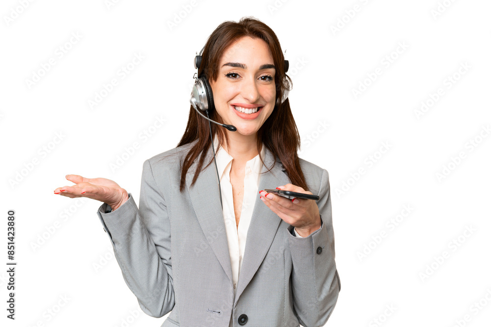 Telemarketer caucasian woman working with a headset over isolated chroma key background keeping a conversation with the mobile phone with someone Telemarketer caucasian woman working with a headset over isolated chroma key background keeping a conversation with the mobile phone with someone