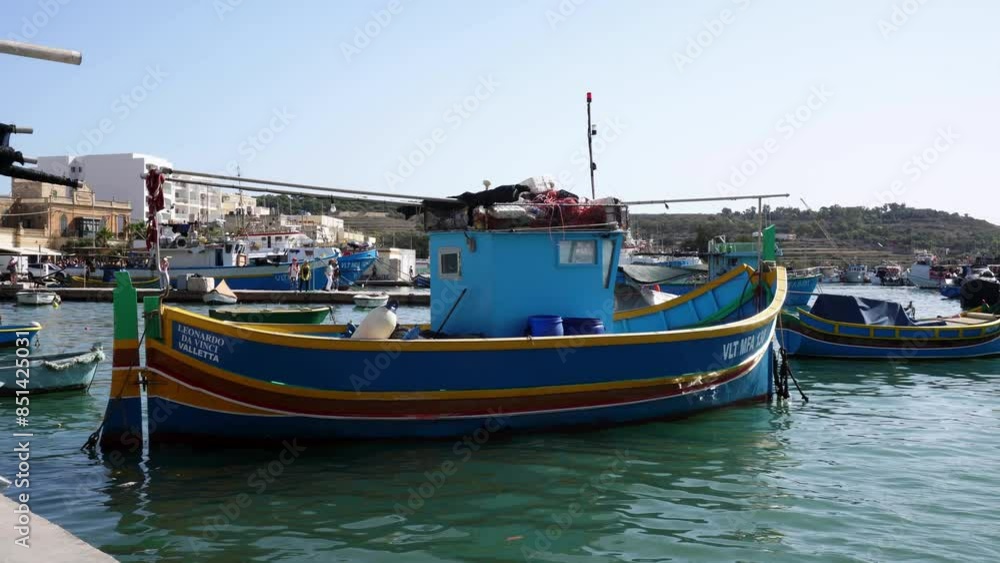 Marsaxlokk harbour with Traditional Luzzu fishing boats, a beautiful Mediterranean town on a sunny day. Old Colorful Boats. Malta Marsaxlokk harbour with Traditional Luzzu fishing boats, a beautiful Mediterranean town on a sunny day. Old Colorful Boats. Malta