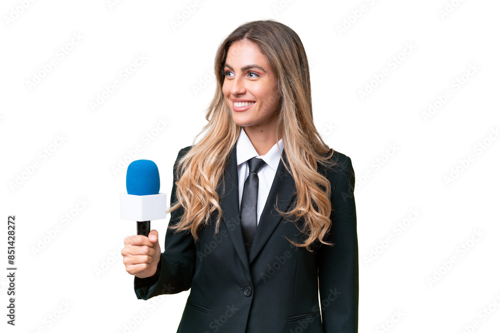 Young pretty Uruguayan tv presenter over isolated background looking side