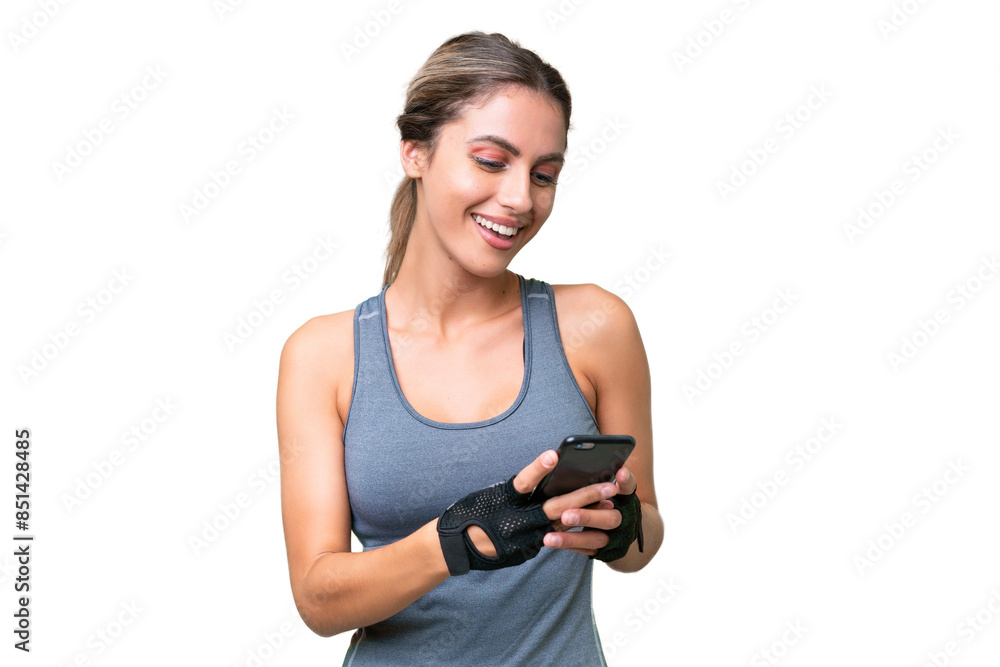 pretty Sport Uruguayan woman over isolated background sending a message with the mobile pretty Sport Uruguayan woman over isolated background sending a message with the mobile