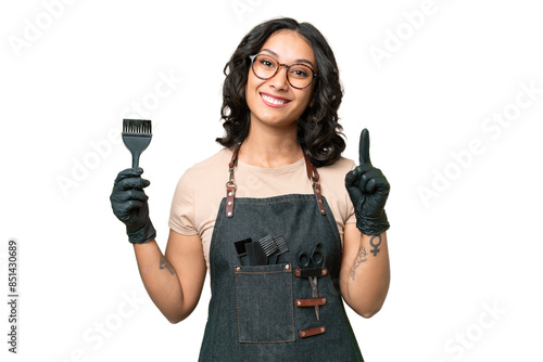 Young argentinian hairdresser woman over isolated background showing and lifting a finger in sign of the best photo