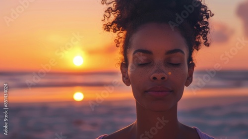 A woman peacefully enjoys a sunset moment on the beach, capturing serenity in nature and the beauty of the scene AIG58 photo