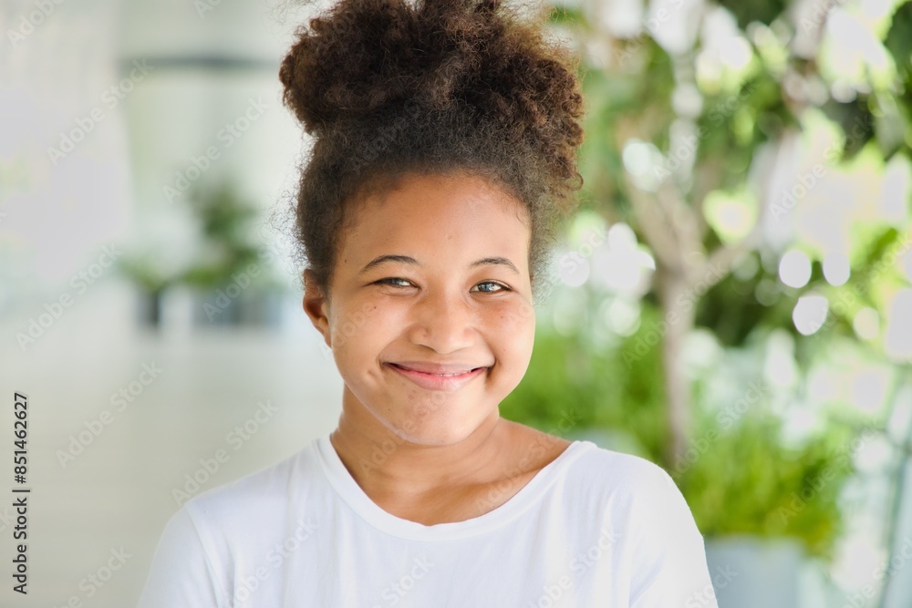 Happy, smiling, friendly young African woman in casual dress, showing positive facial expression. Happy, smiling, friendly young African woman in casual dress, showing positive facial expression.