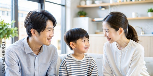 A joyful moment captured as a loving family of three enjoys quality time together in their bright and modern living room.