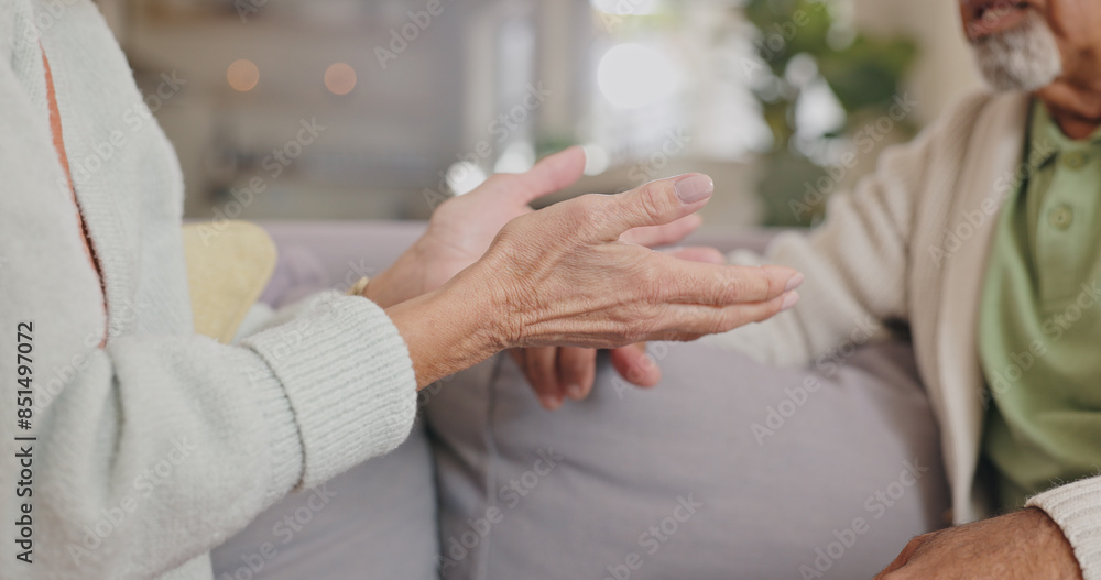 Obraz premium Hands, lounge and senior couple, talking and closeup in house, discussion and communication with partner. Living room, sofa and speaking of mature people, conversation and divorce in apartment