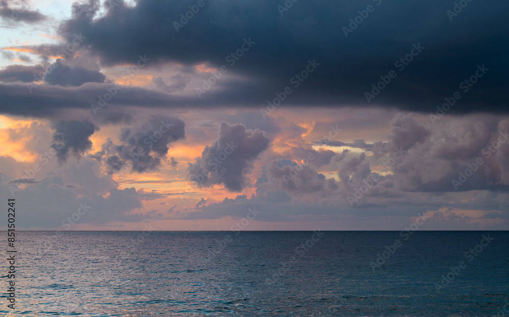 Sunset on sea. Beach sunrise with cloudy sky. Sunset on sea. Beach sunrise with cloudy sky.