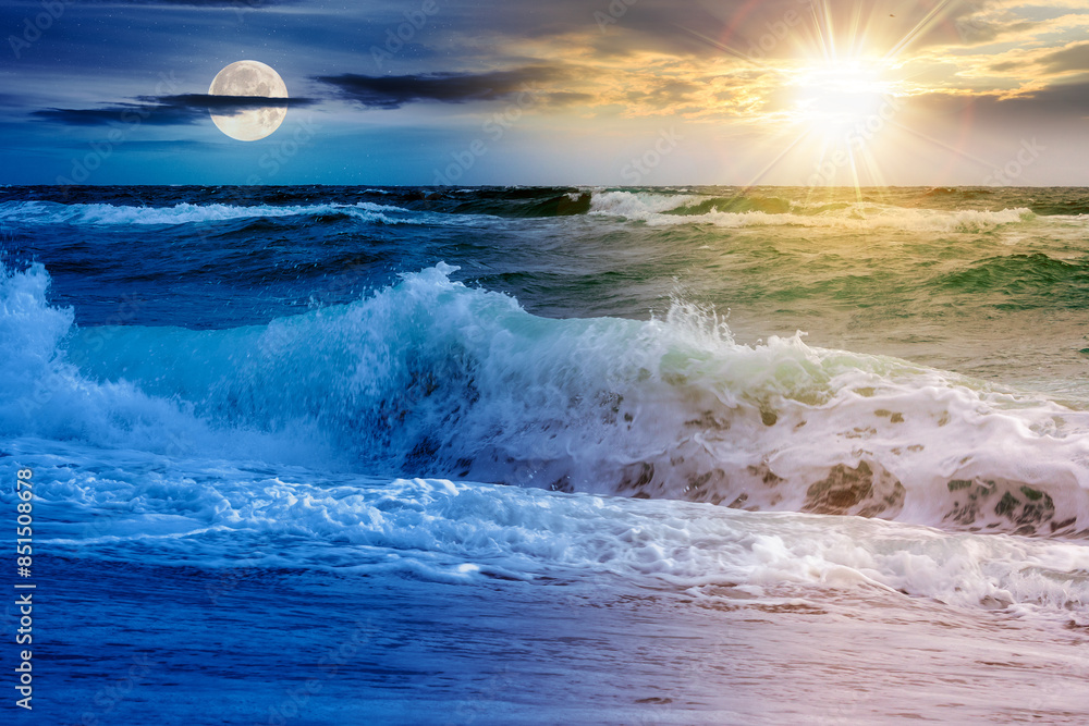 dramatic seascape at summer solstice. waves crashing the shore beneath a sky with sun and moon above horizon. day and night time change concept