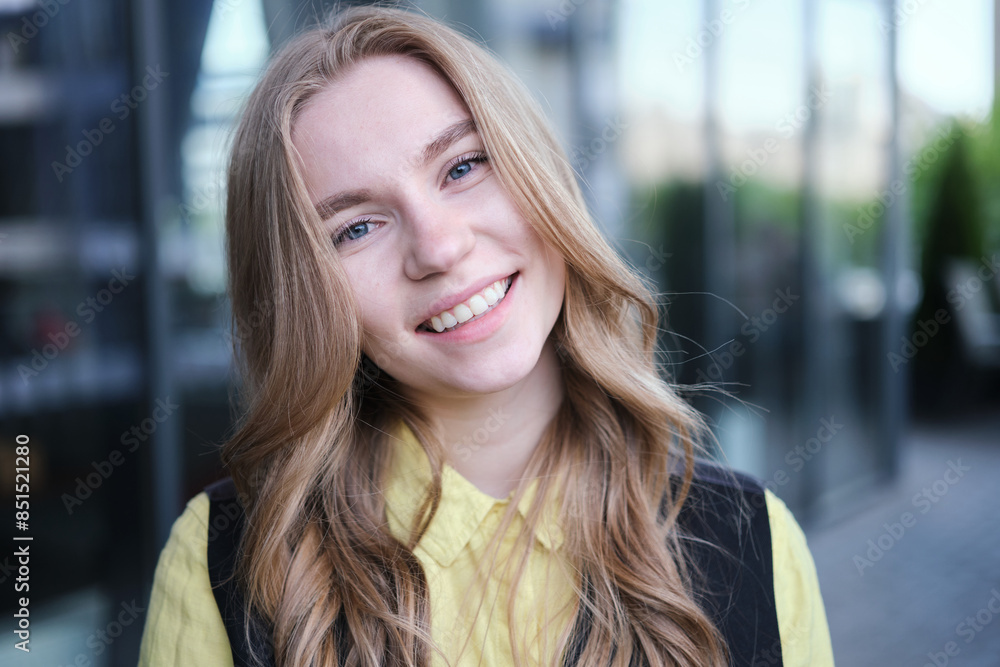 Portrait of a attractive young positive adult female on the business background. Student, business woman, services. High quality photo Portrait of a attractive young positive adult female on the business background. Student, business woman, services. High quality photo