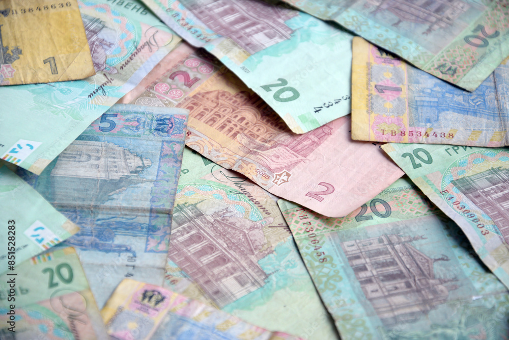 Processed collage of Ukrainian Hryvnia UAH bills banknotes texture. Background for banner Processed collage of Ukrainian Hryvnia UAH bills banknotes texture. Background for banner