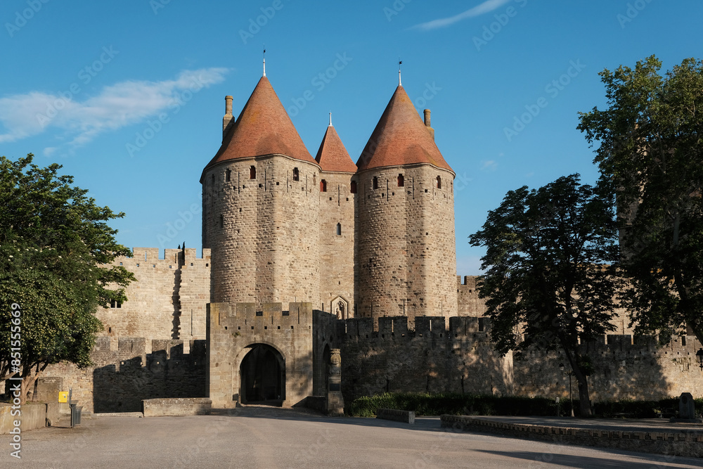 View of Narbonnaise Gates of Carcassonne Fortress on sunny morning, France. View of Narbonnaise Gates of Carcassonne Fortress on sunny morning, France.