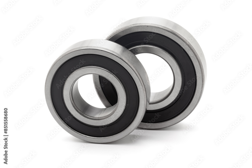 Two tapered roller bearings, isolated on a white background. Two tapered roller bearings, isolated on a white background.
