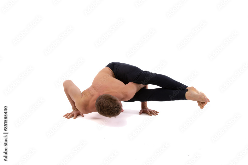 A young attractive man is doing yoga. White background. A young attractive man is doing yoga. White background.