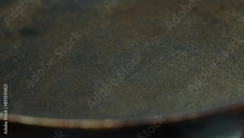 the frying pan on which the top non-stick layer of Teflon was damaged	