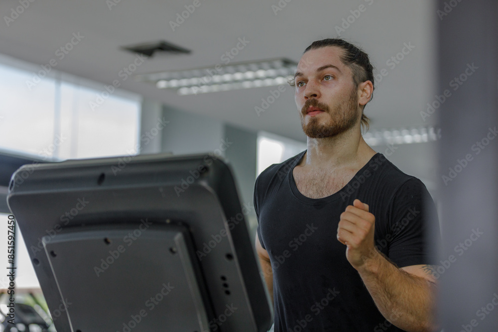 young caucasian man in sportswear exercise running treadmill fitness in gym health club. Sportsman muscle slim motivation run fitness calories burn lose weight for health. young caucasian man in sportswear exercise running treadmill fitness in gym health club. Sportsman muscle slim motivation run fitness calories burn lose weight for health.