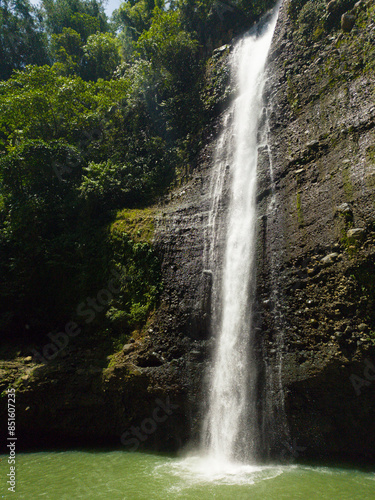 Green plunge basin with flowing water. Alalum Falls. Bukidnon, Philippines.