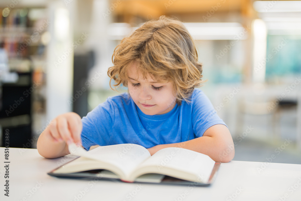 Kid reading book. Child reading book in a public library. Kid reading book. Child reading book in a public library.