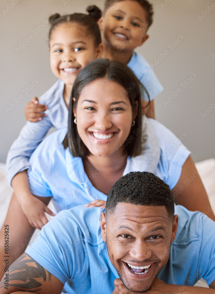 Family, pile and portrait on bed for love, smile and connection or security in home for bonding. Parents, children and stack in bedroom on morning for peace, wake up and embrace for support or happy Family, pile and portrait on bed for love, smile and connection or security in home for bonding. Parents, children and stack in bedroom on morning for peace, wake up and embrace for support or happy