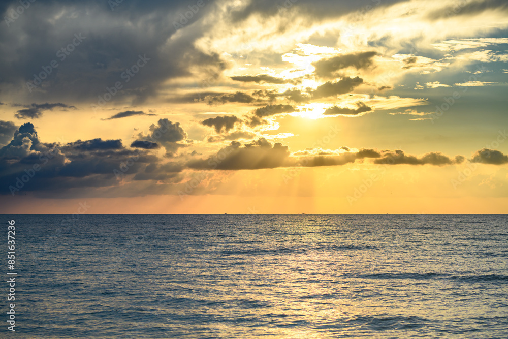 Sea beach with sky sunset or sunrise. Cloudscape over the sunset sea. Sunset at tropical beach. Nature sunset sky of sea. Dramatic clouds. Sea beach with sky sunset or sunrise. Cloudscape over the sunset sea. Sunset at tropical beach. Nature sunset sky of sea. Dramatic clouds.
