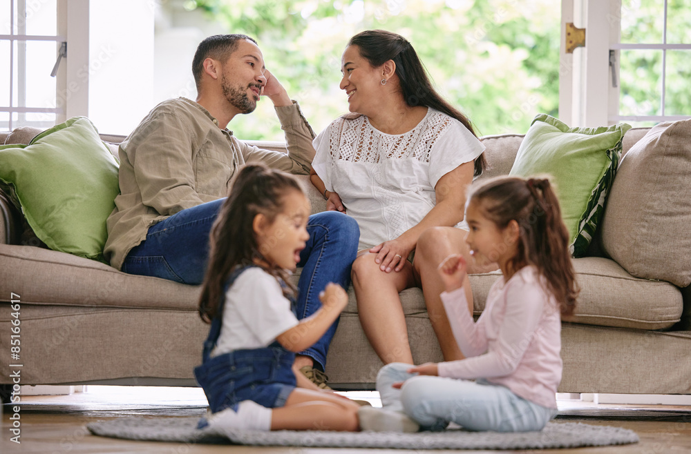 Parents, kids and together in living room for games, conversation and relaxation on sofa at home. Sisters, mother and father on couch for weekend, development and playful on floor in family home Parents, kids and together in living room for games, conversation and relaxation on sofa at home. Sisters, mother and father on couch for weekend, development and playful on floor in family home