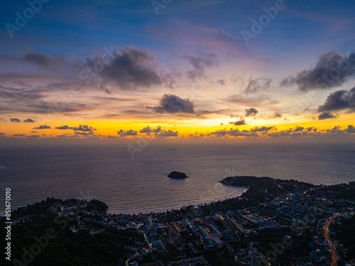 aerial view colorful cloud in sunset looked strangely beautiful. Horizon dramatic twilight sky and cloud sunset background. amazing sky at sunset scenery sunset above the island at Kata beach Phuket. photo