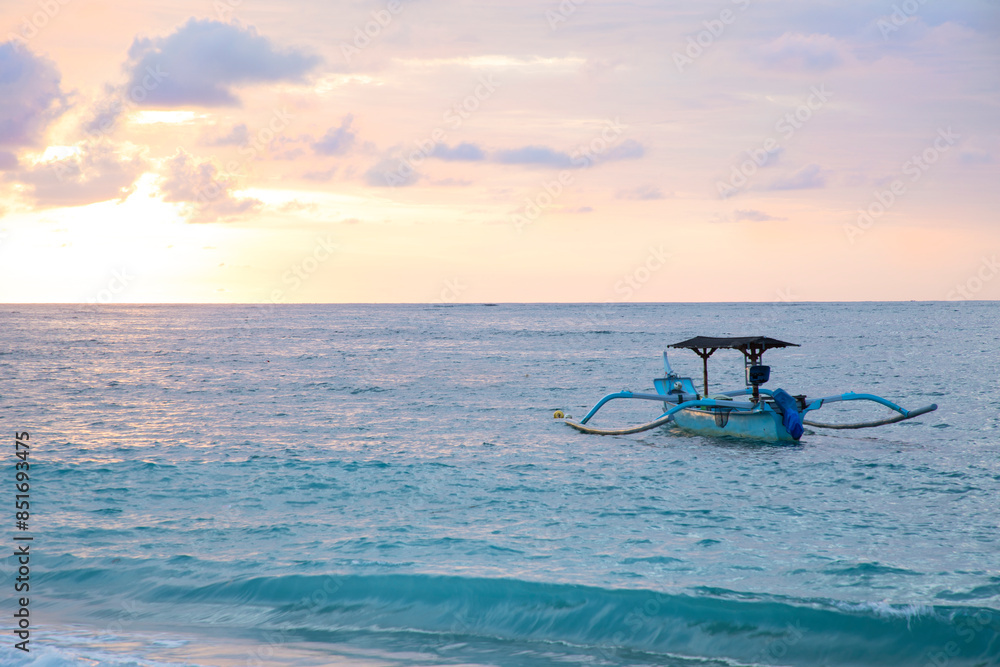 Beautiful view of the boats on Kuta beach in Bali Island, Indonesia