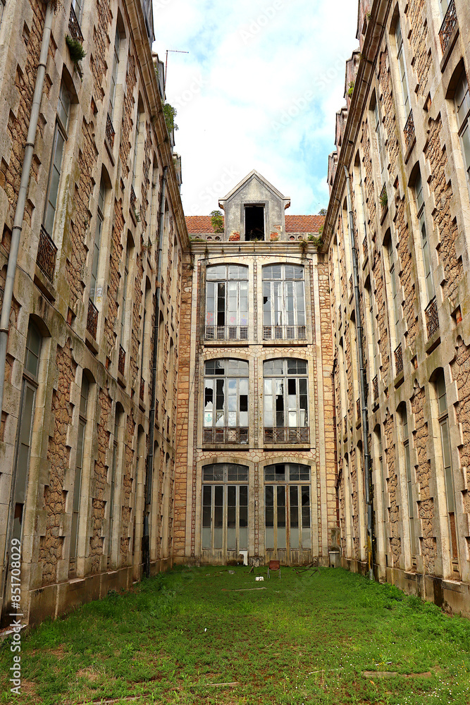 Facades of a large abandoned building with broken windows. Pavilions of D. Carlos I Park in Caldas da Rainha, Portugal. Facades of a large abandoned building with broken windows. Pavilions of D. Carlos I Park in Caldas da Rainha, Portugal.