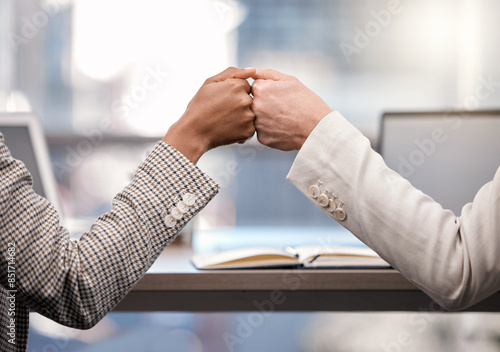 Business, woman and hands in office with fist bump for motivation, project partnership and corporate victory. Female employees, together and support in workplace with accomplishment and achievement.