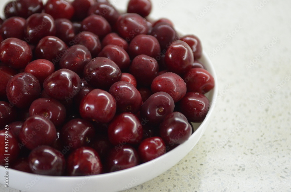 Red cherry in a bowl. Red sweet cherry background. Red cherry in a bowl. Red sweet cherry background.