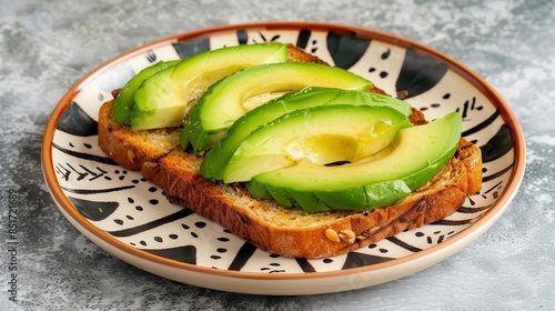 Avocado toast served on a tribalpatterned plate, symbolizing a fusion of modern and traditional tastes photo