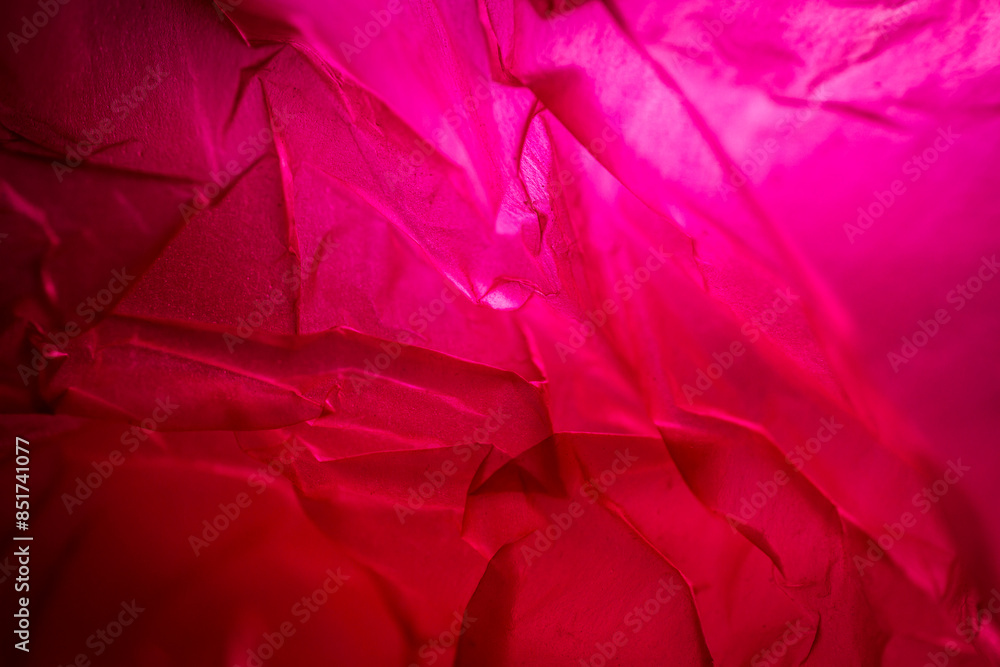 Extreme close up of red empty plastic bag background. Extreme close up of red empty plastic bag background.