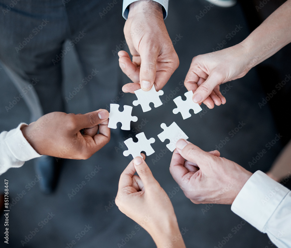 Hands, puzzle and above for teamwork in office with business people, support and connection for solution. Group, scrum and jigsaw with synergy, strategy and problem solving with link in workplace Hands, puzzle and above for teamwork in office with business people, support and connection for solution. Group, scrum and jigsaw with synergy, strategy and problem solving with link in workplace