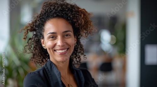 Portrait of a confident multiethnic businesswoman smiling at the camera in her office environment