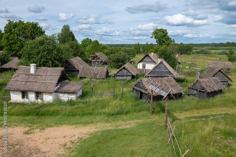 Old village-set for filming historical films on a June day. Loskovitsy (Loskovskoye) tract. Pskov region, Russia Old village-set for filming historical films on a June day. Loskovitsy (Loskovskoye) tract. Pskov region, Russia