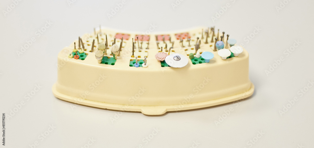 Bur, set and dental tools for healthcare on studio background with instrument layout for teeth cleaning or oral hygiene. Medical, dentistry equipment and setup for tooth wellness and mouth procedure Bur, set and dental tools for healthcare on studio background with instrument layout for teeth cleaning or oral hygiene. Medical, dentistry equipment and setup for tooth wellness and mouth procedure