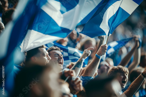 A close-up shot of Scottish football fans with Saltire flags, cheering and singing in the stands, creating a spirited and lively scene