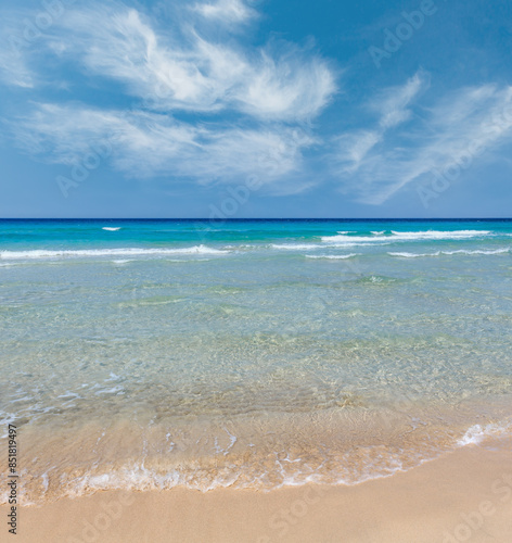 Sea surf on beach.