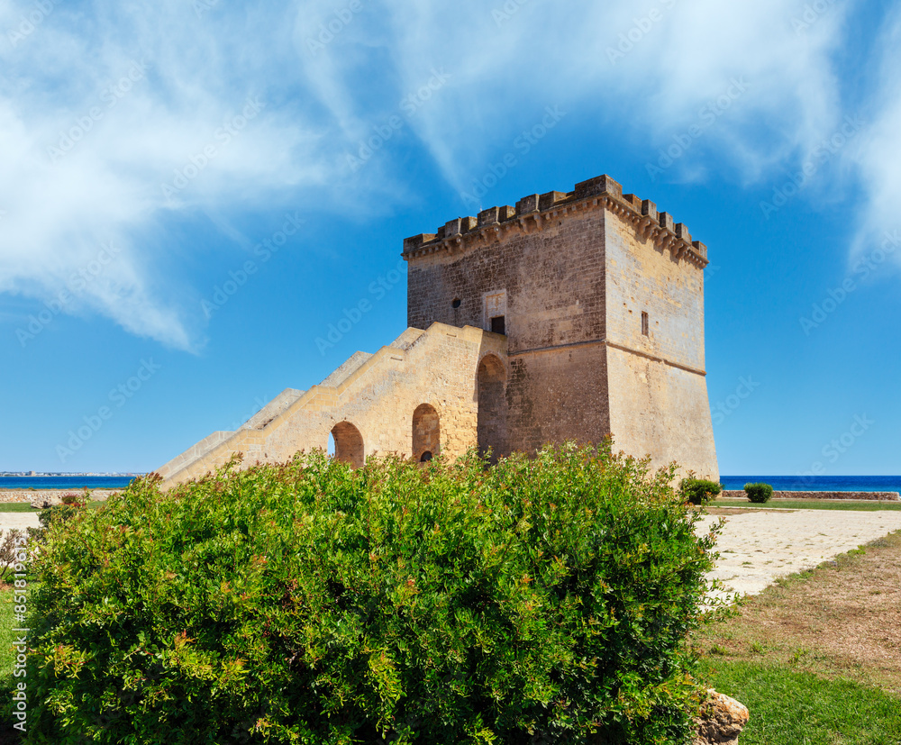 Picturesque historical fortification tower Torre Lapillo (St. Thomas Tower) Torre di San Tommaso on Salento Ionian sea coast, Puglia, Italy