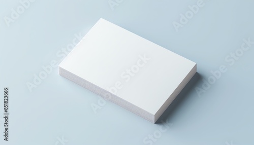 Stack of blank white paper sheets on a light blue background, suitable for business, office, stationery, and printing concepts. © Anatthaphon
