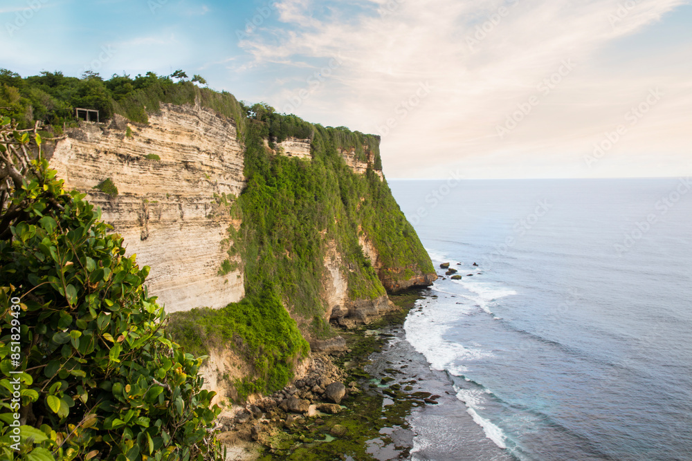 Beautiful view of Uluwatu rock at sunset in Bali, Indonesia