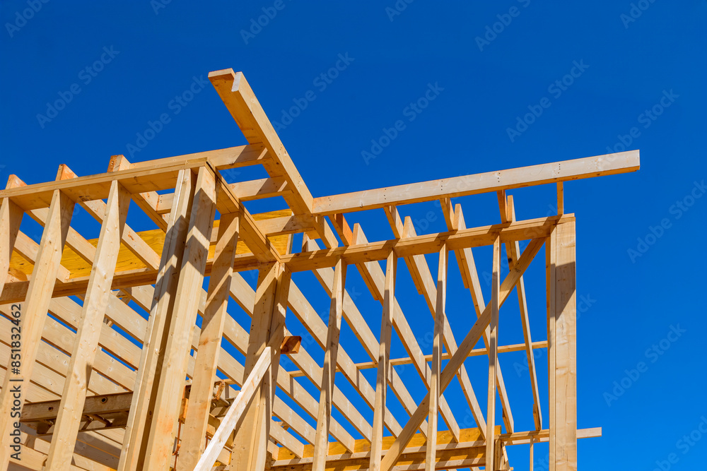 Construction new home requires installation of walls, framework beams trusses Construction new home requires installation of walls, framework beams trusses