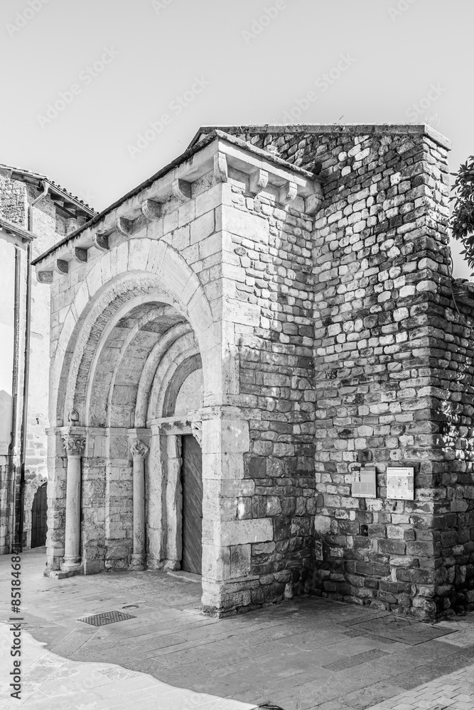 Besalú, Catalonia, Spain: Saint Julian church hospital, original 12th century facade in black and white Besalú, Catalonia, Spain: Saint Julian church hospital, original 12th century facade in black and white