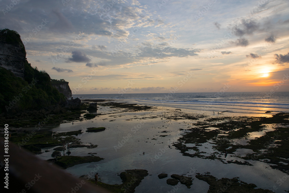 Beautiful view of Uluwatu Beach at sunset in Bali, Indonesia