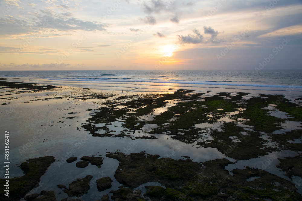 Beautiful view of Uluwatu Beach at sunset in Bali, Indonesia