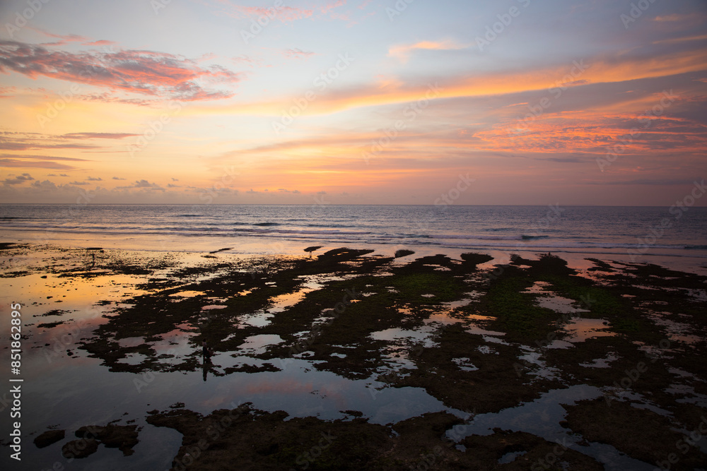 Beautiful view of Uluwatu Beach at sunset in Bali, Indonesia
